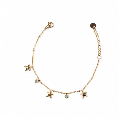 Dettaglio del bracciale Marea color argento con stelle marine pendenti e cristalli luminosi
