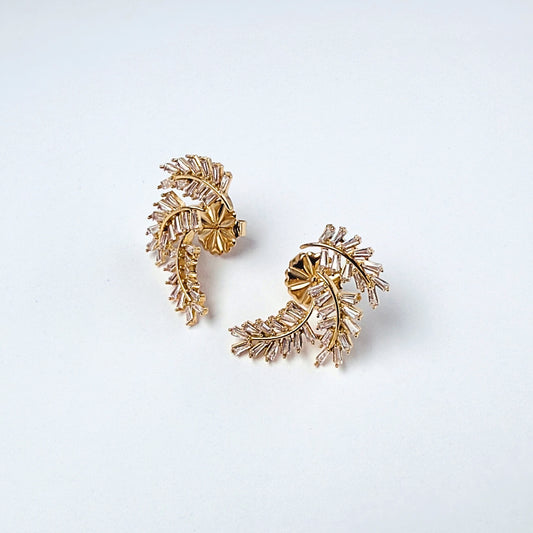 Aurora Palm · Orecchini a foglia in acciaio inox con strass baguette