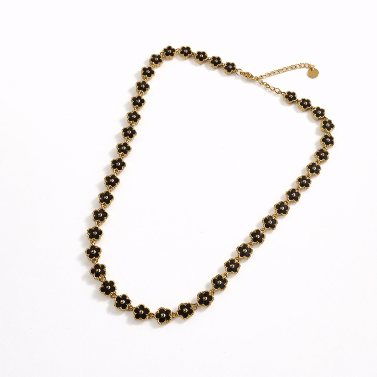 Fiorella Bloom – Collana Floreale Nera in Acciaio Inox Dorato